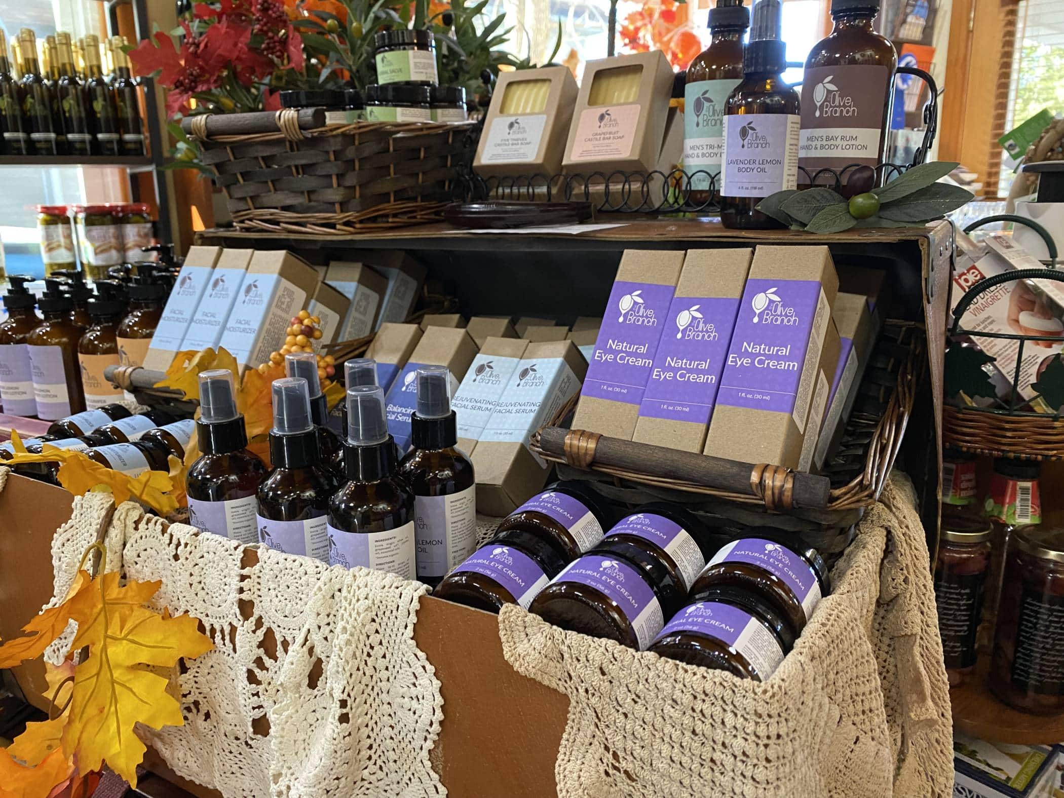 Display of a variety of olive oil skincare items at The Olive Branch in Winona Lake, IN